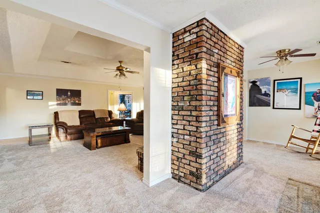 a spacious bathroom with a granite countertop sink a mirror and a bathtub