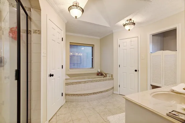 a bathroom with a double vanity sink mirror and toilet