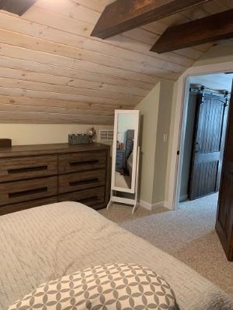 315 Hartwick Street Springfield, MA 01108 - Photo 24 of 40 a bedroom with a bed and a mirror