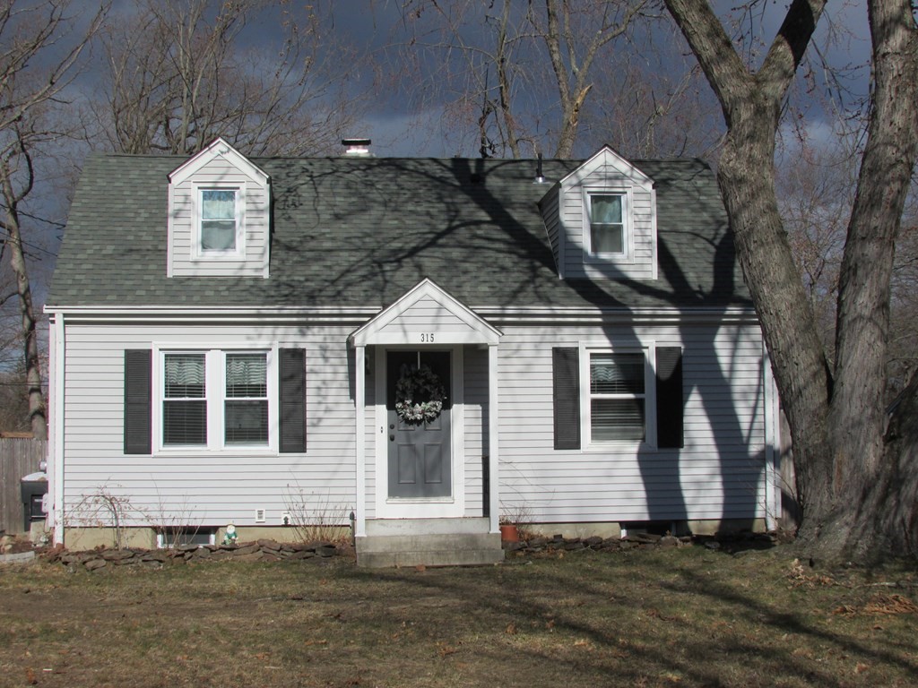 315 Hartwick Street Springfield, MA 01108 - Photo 3 of 40 a front view of a house with a yard