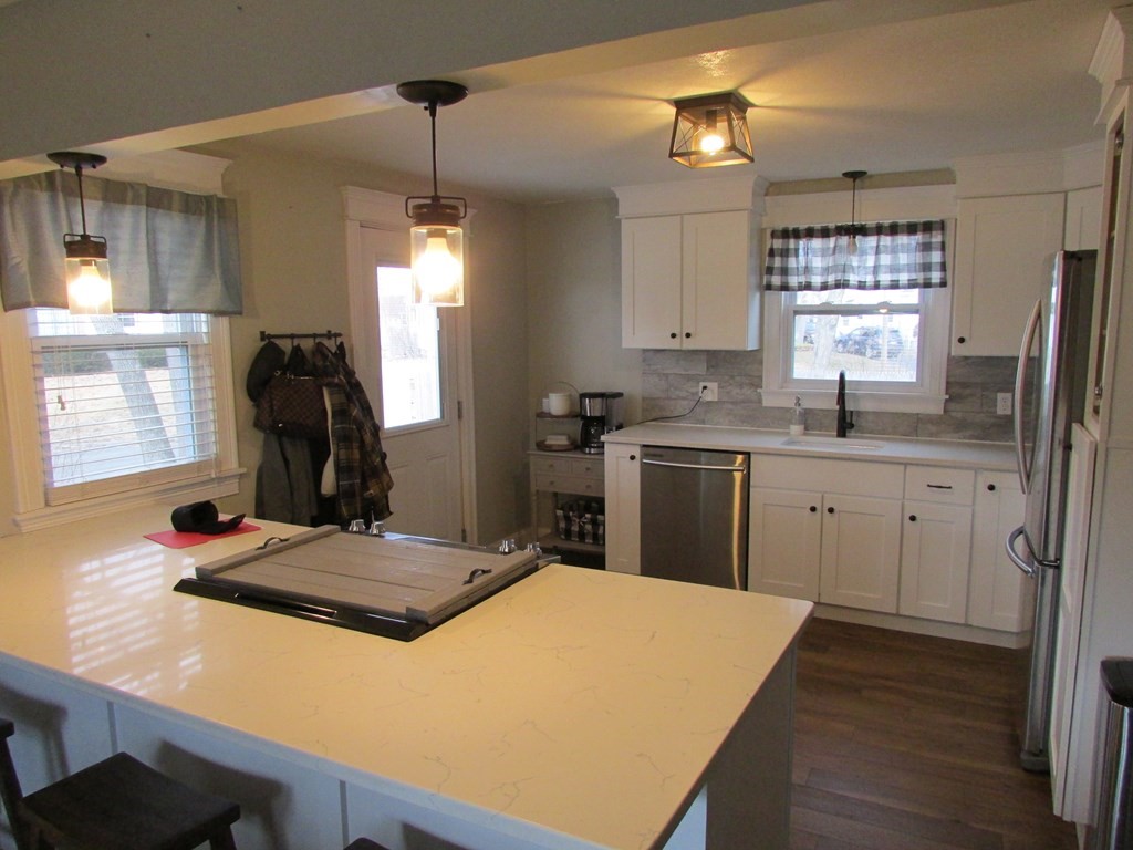 315 Hartwick Street Springfield, MA 01108 - Photo 10 of 40 a kitchen with sink a window and refrigerator