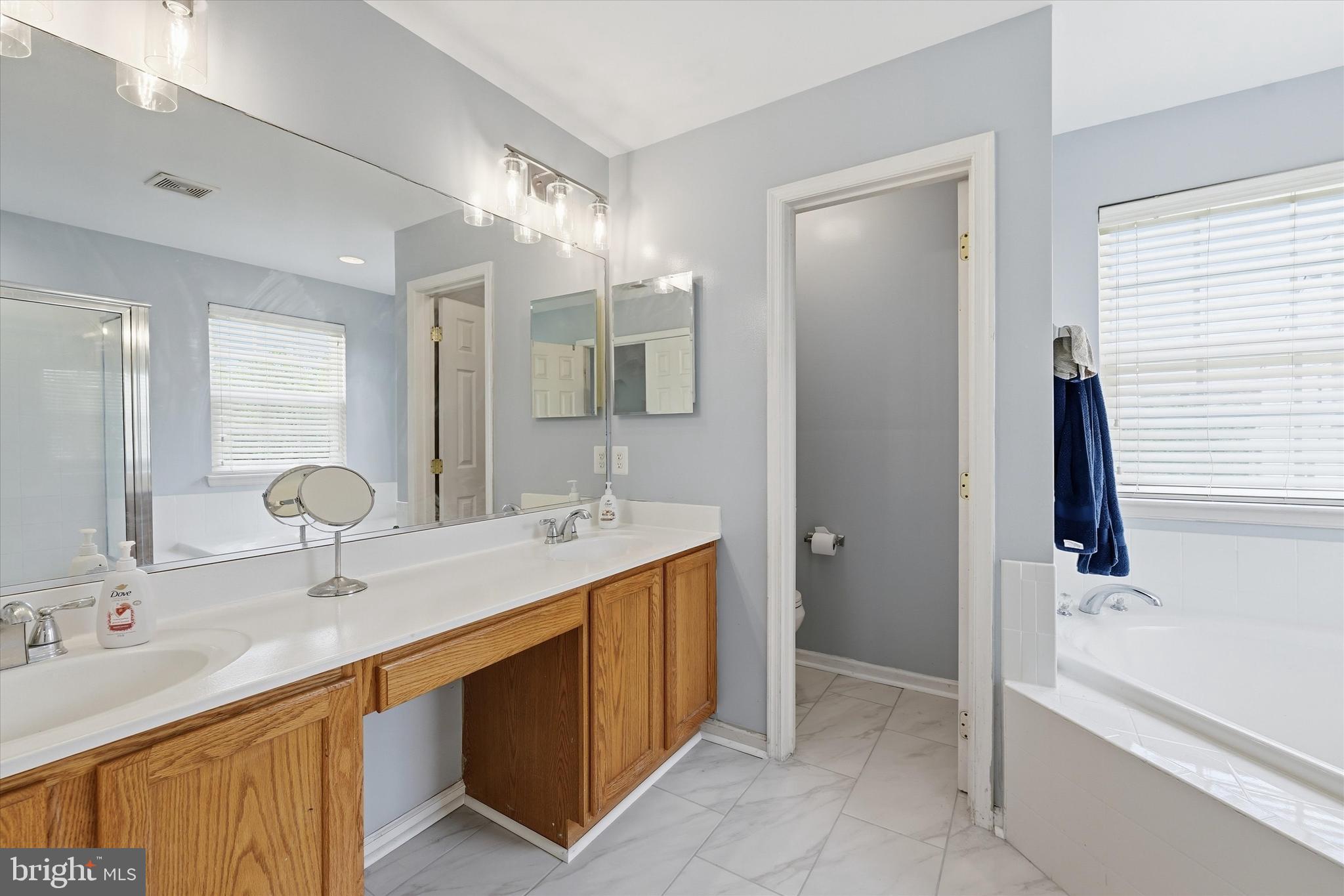 24 Overbrook Road Ranson, WV 25438 - Photo 10 of 21 a bathroom with a double vanity sink and a mirror