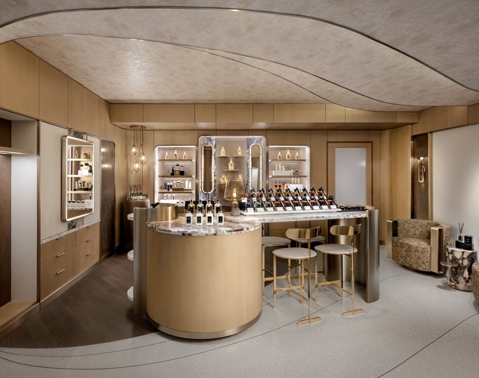 40 Trinity Place, Unit 32A Boston, MA 02116 - Photo 18 of 32 a kitchen with a refrigerator and a table