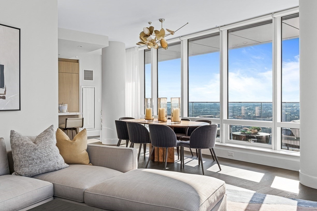40 Trinity Place, Unit 32A Boston, MA 02116 - Photo 2 of 32 a living room with furniture and a large window