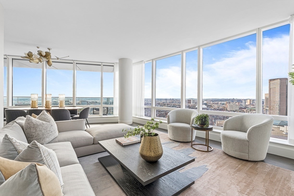 40 Trinity Place, Unit 32A Boston, MA 02116 - Photo 3 of 32 a living room with furniture and a large window