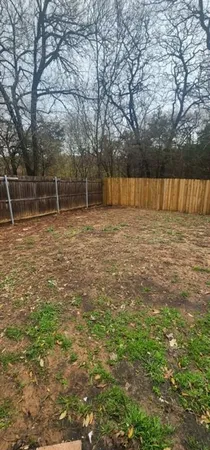 a backyard of a house with lots of green space