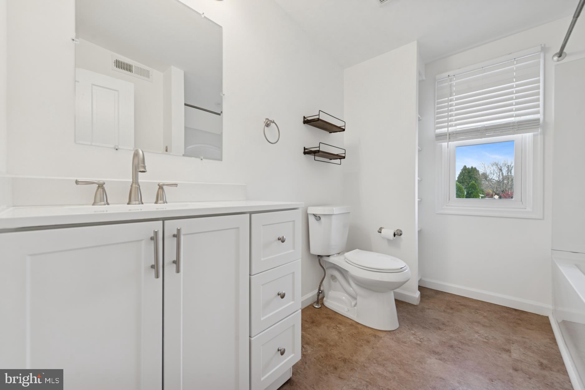 92 Embreeville Road Downingtown, PA 19335 - Photo 20 of 30 a bathroom with a toilet sink and mirror