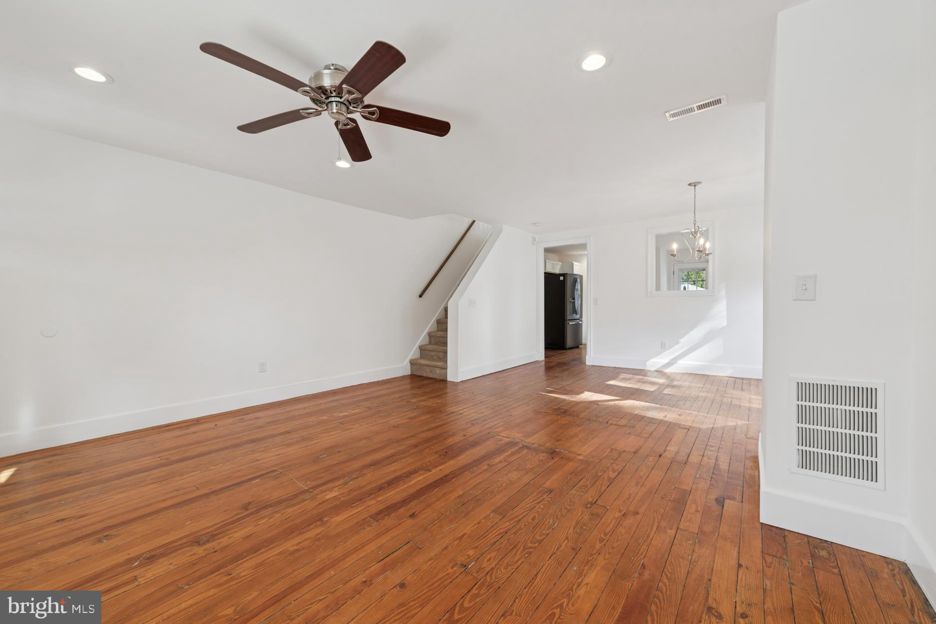 92 Embreeville Road Downingtown, PA 19335 - Photo 7 of 30 a view of an empty room with wooden floor and a ceiling fan