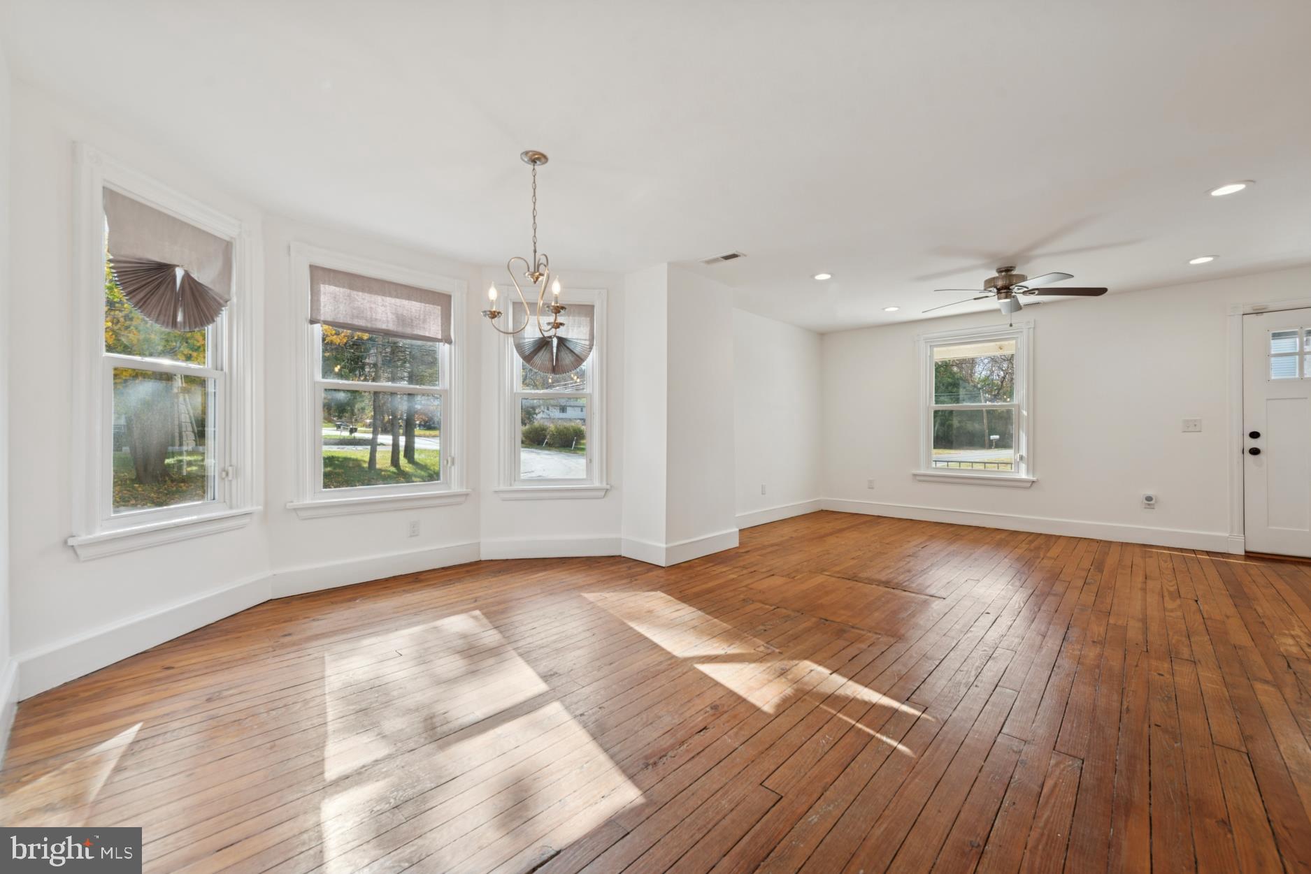 92 Embreeville Road Downingtown, PA 19335 - Photo 8 of 30 a view of an empty room with wooden floor and a window