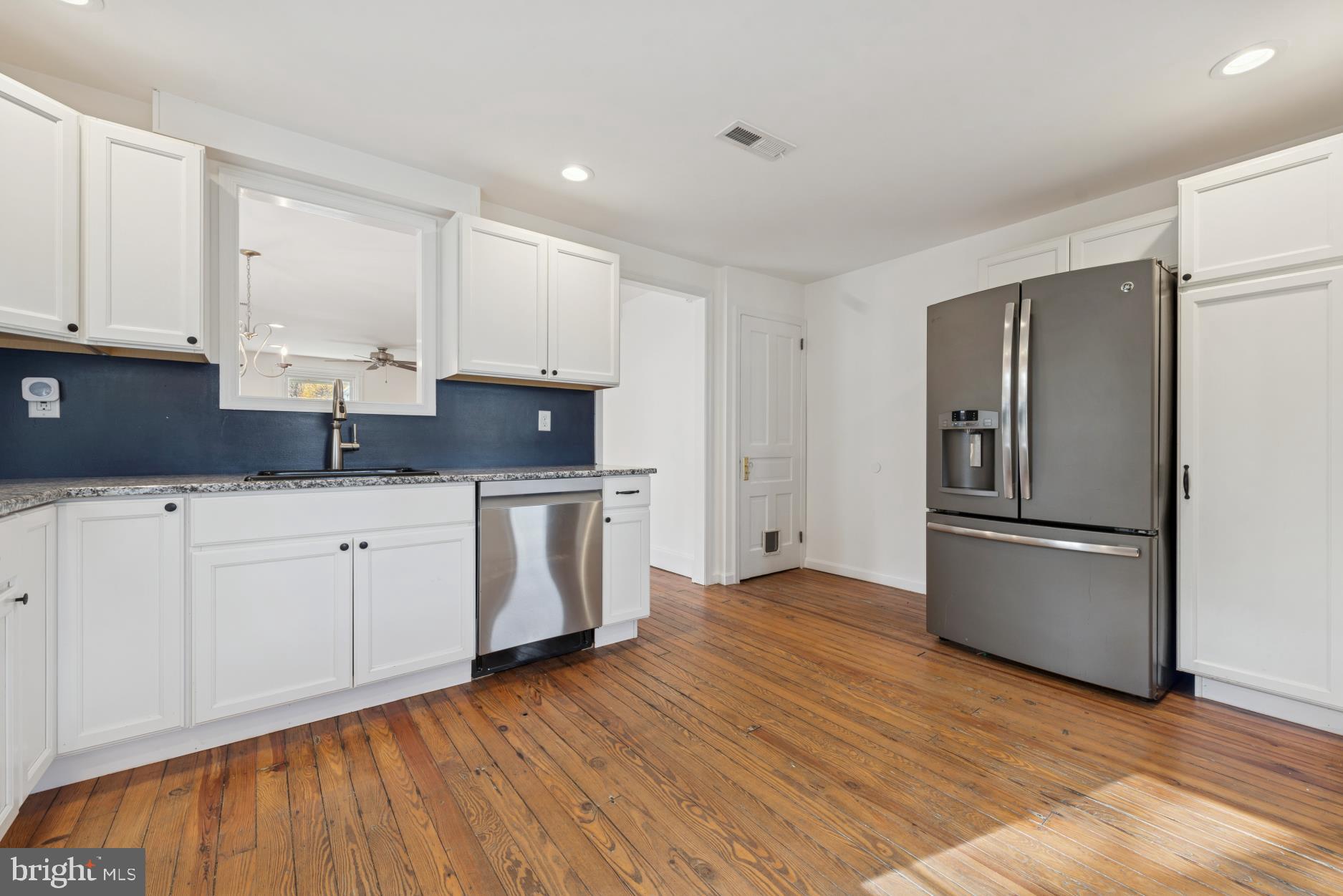 92 Embreeville Road Downingtown, PA 19335 - Photo 10 of 30 a kitchen with stainless steel appliances granite countertop a refrigerator sink and white cabinets