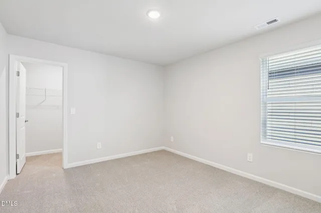 a view of a bedroom with closet area