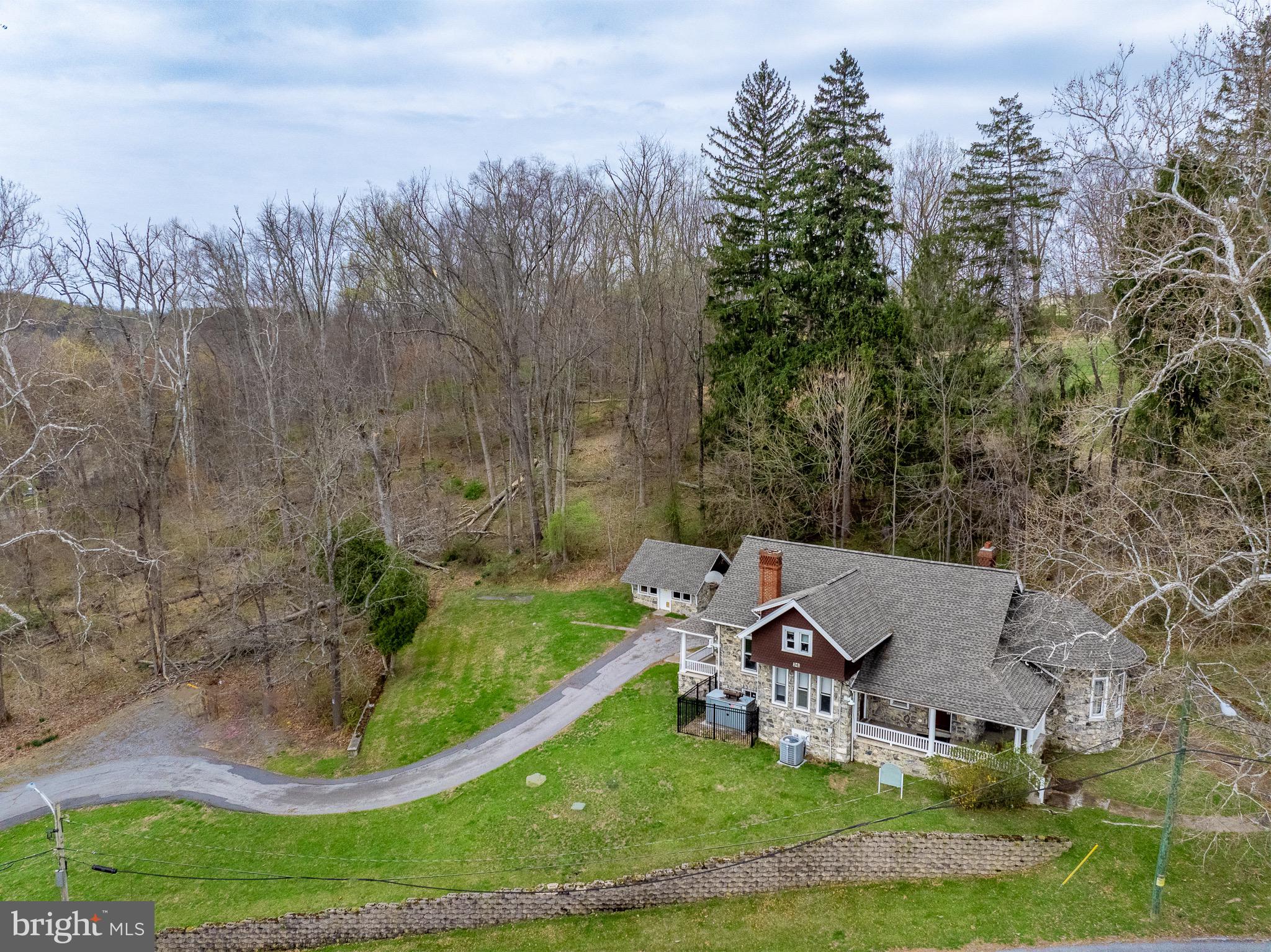 an aerial view of a house with outdoor space