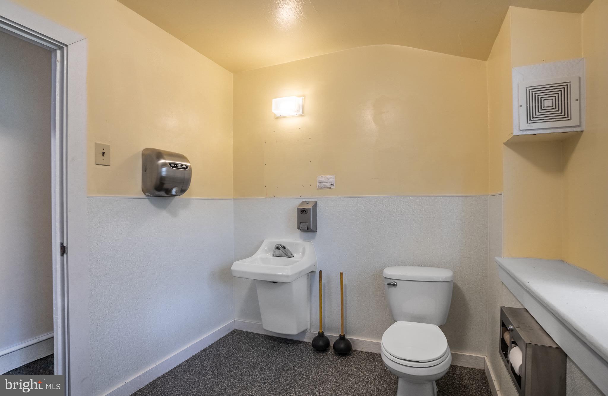 0 Devereux Road Glenmoore, PA 19343 - Photo 25 of 33 a white toilet sitting next to a white sink and vanity