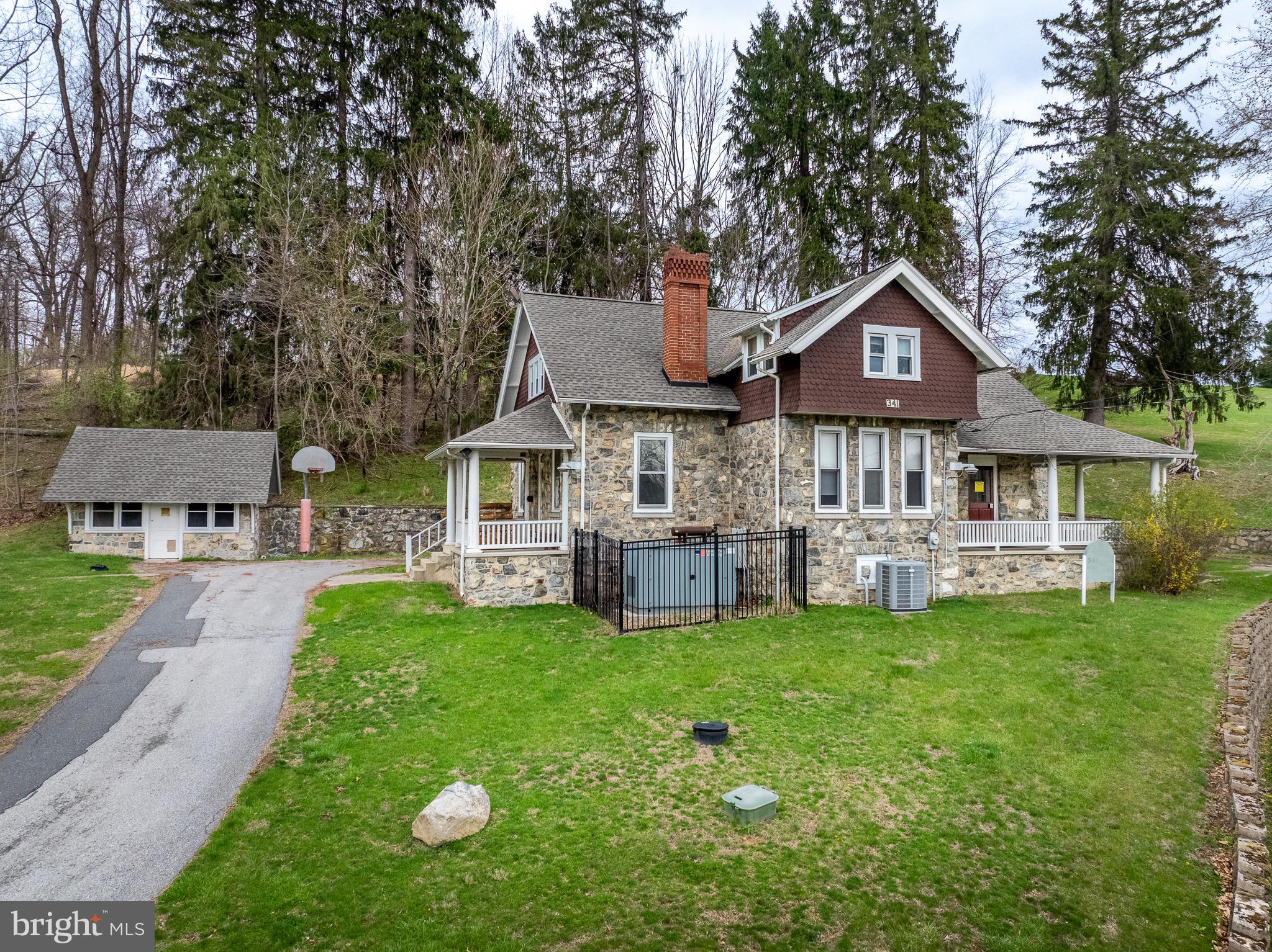 0 Devereux Road Glenmoore, PA 19343 - Photo 7 of 33 a front view of a house with a garden and trees