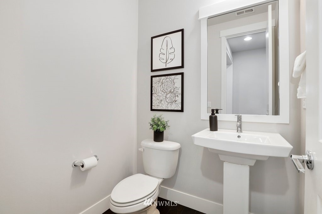 4327 223rd Place Southeast Bothell, WA 98021 - Photo 17 of 40 a bathroom with a toilet a sink and mirror