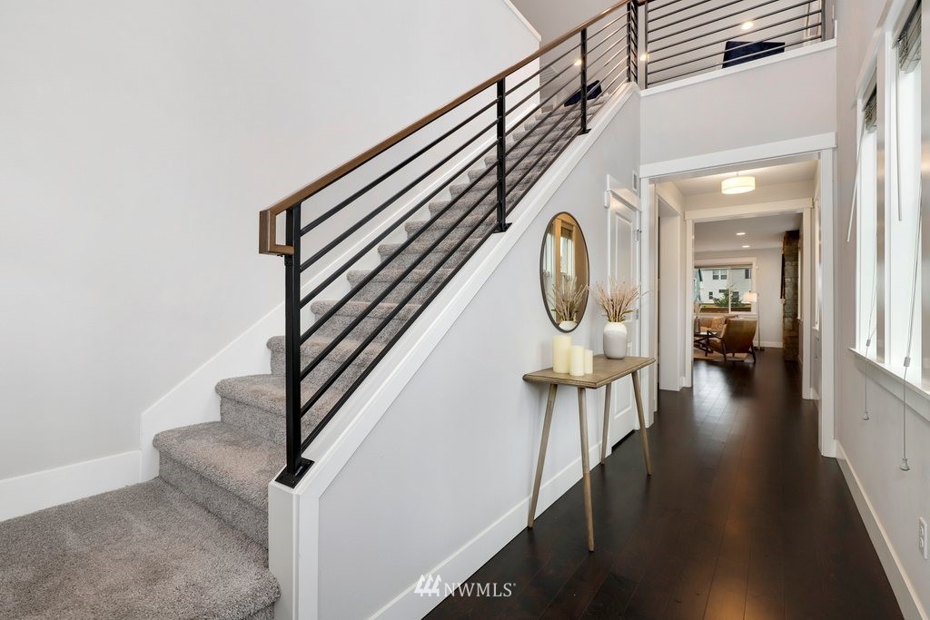 4327 223rd Place Southeast Bothell, WA 98021 - Photo 18 of 40 a view of a hallway with wooden floor and staircase