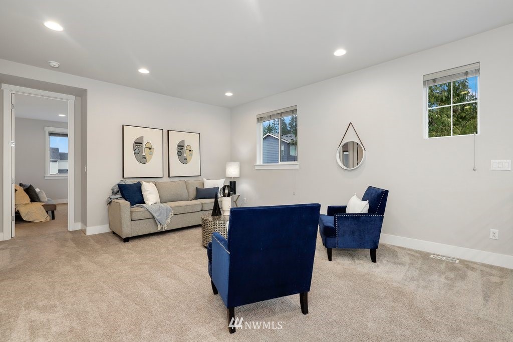 4327 223rd Place Southeast Bothell, WA 98021 - Photo 19 of 40 a living room with furniture and a window