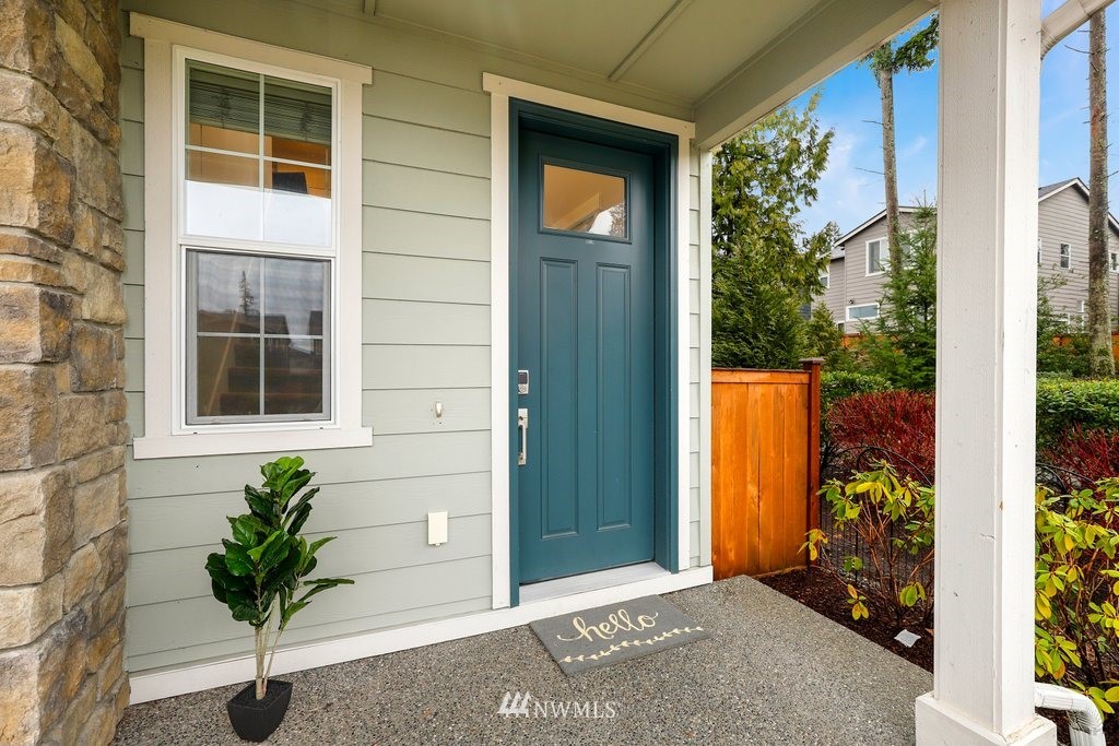 4327 223rd Place Southeast Bothell, WA 98021 - Photo 2 of 40 a potted plant sitting in front of a house