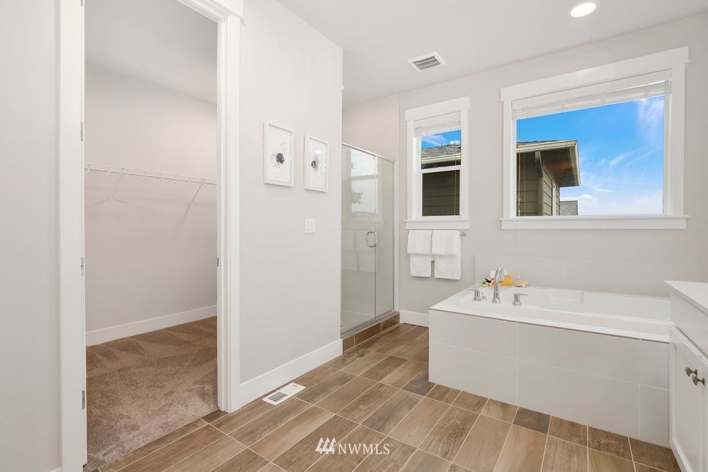 4327 223rd Place Southeast Bothell, WA 98021 - Photo 24 of 40 a bathroom with a bathtub sink and mirror