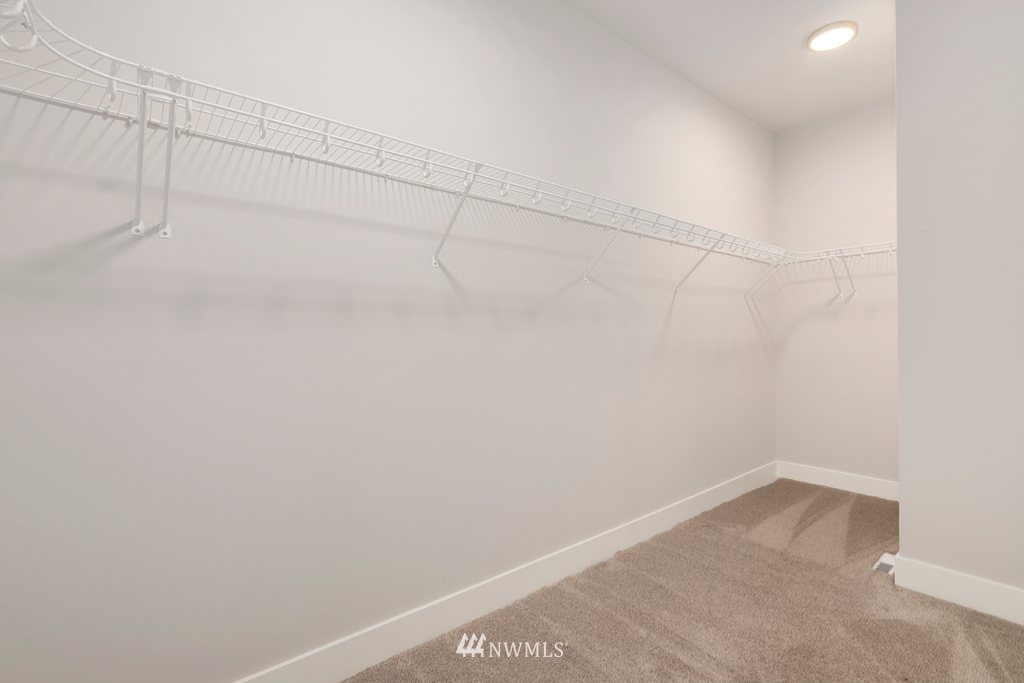 4327 223rd Place Southeast Bothell, WA 98021 - Photo 25 of 40 a view of a room with racks on the wall