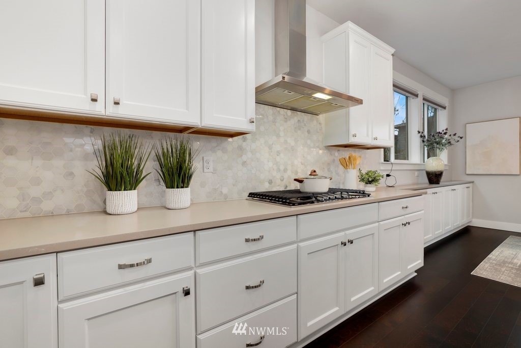 4327 223rd Place Southeast Bothell, WA 98021 - Photo 10 of 40 a kitchen with stainless steel appliances white cabinets and a sink