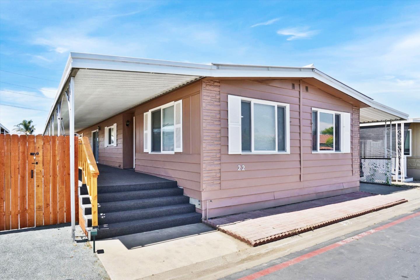 15820 South Harlan Road, Unit 22 Lathrop, CA 95330 - Photo 1 of 18 a front view of a house with stairs