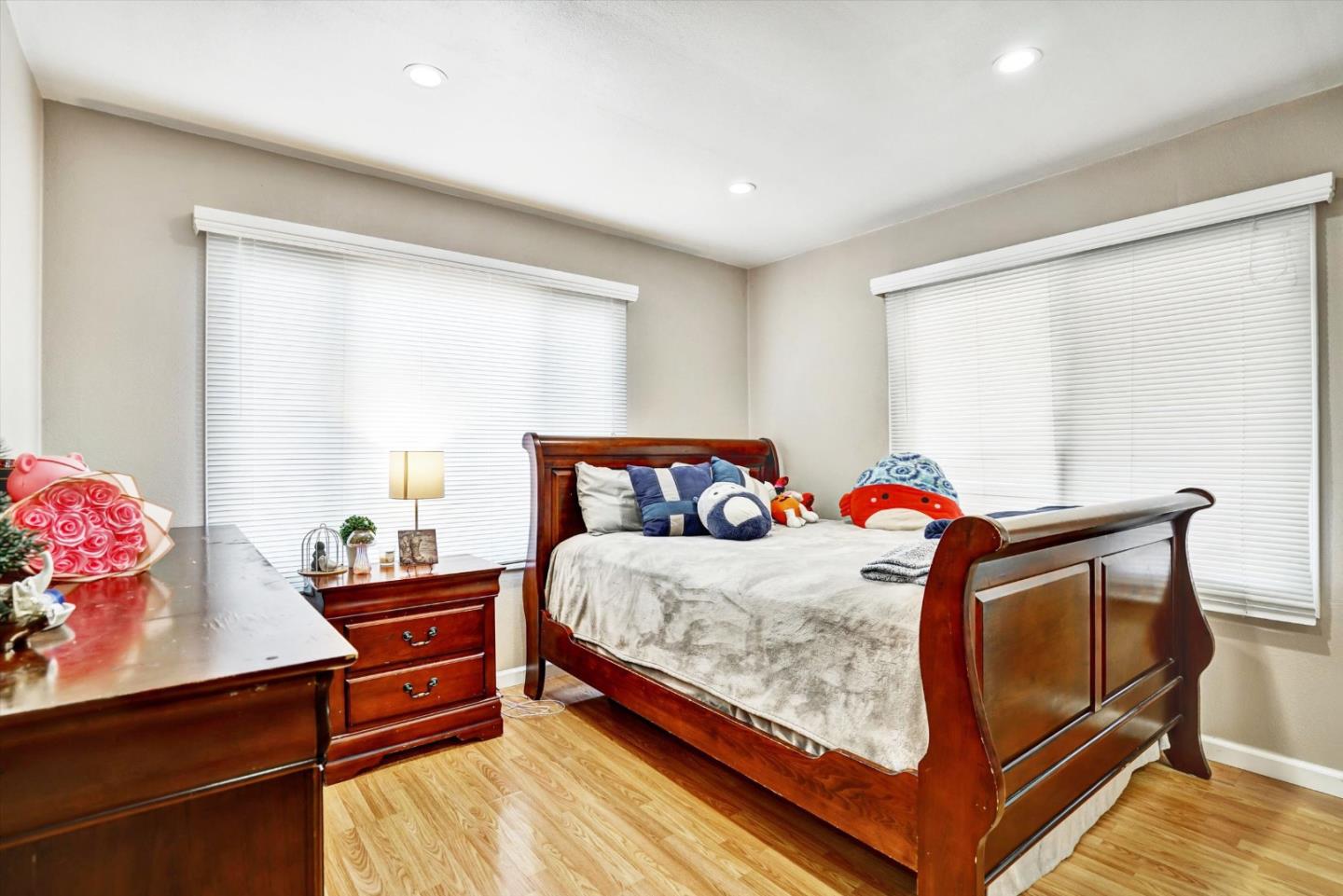 15820 South Harlan Road, Unit 22 Lathrop, CA 95330 - Photo 13 of 18 a bed sitting in a bedroom next to a window