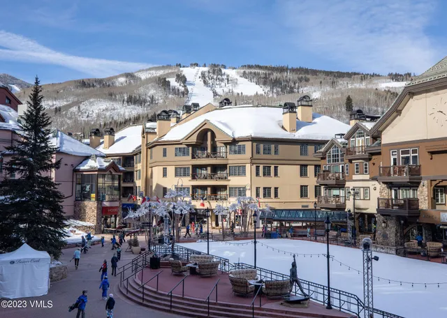 a front view of a building with outdoor seating