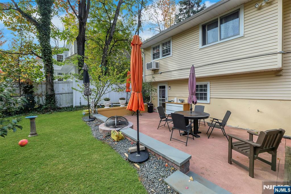 1093 Sheridan Street New Milford, NJ 07646 - Photo 11 of 45 a view of a backyard with sitting area