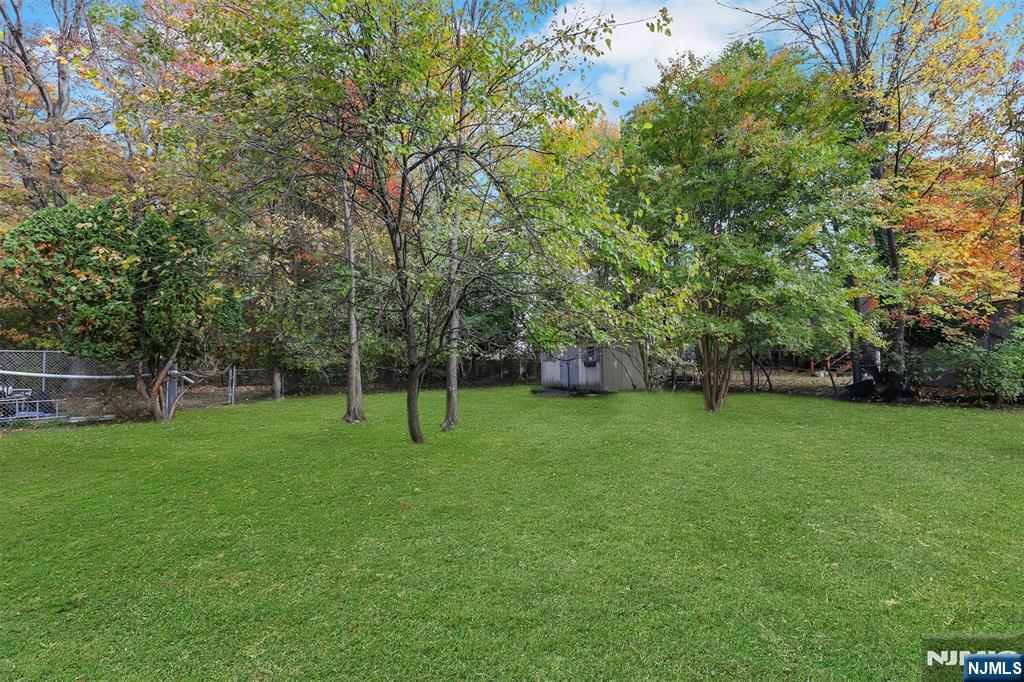 1093 Sheridan Street New Milford, NJ 07646 - Photo 12 of 45 a view of a park with large trees