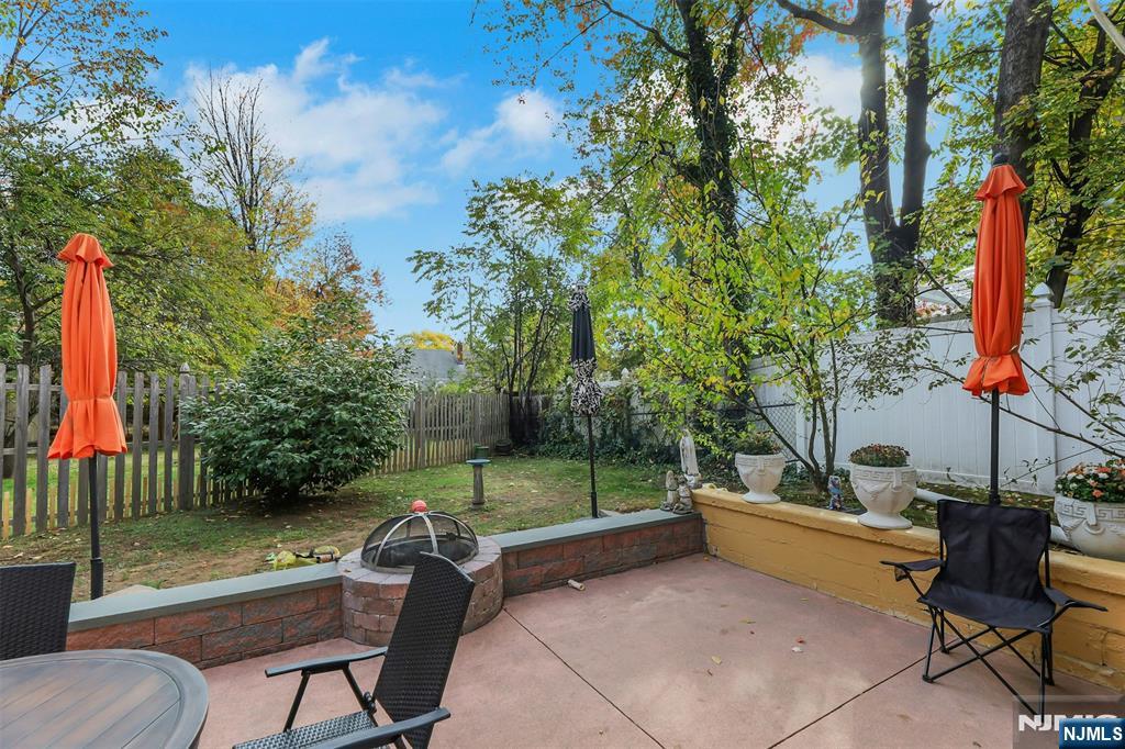 1093 Sheridan Street New Milford, NJ 07646 - Photo 13 of 45 a backyard of a house with table and chairs