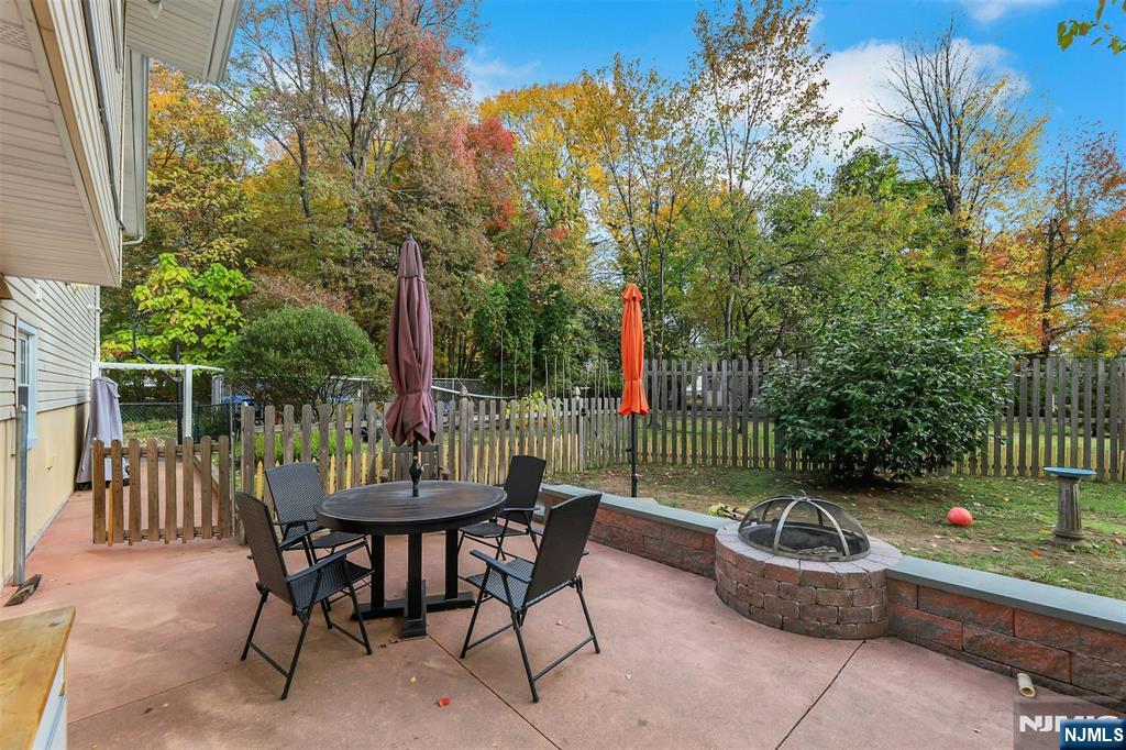1093 Sheridan Street New Milford, NJ 07646 - Photo 14 of 45 a view of a chair and tables in the patio