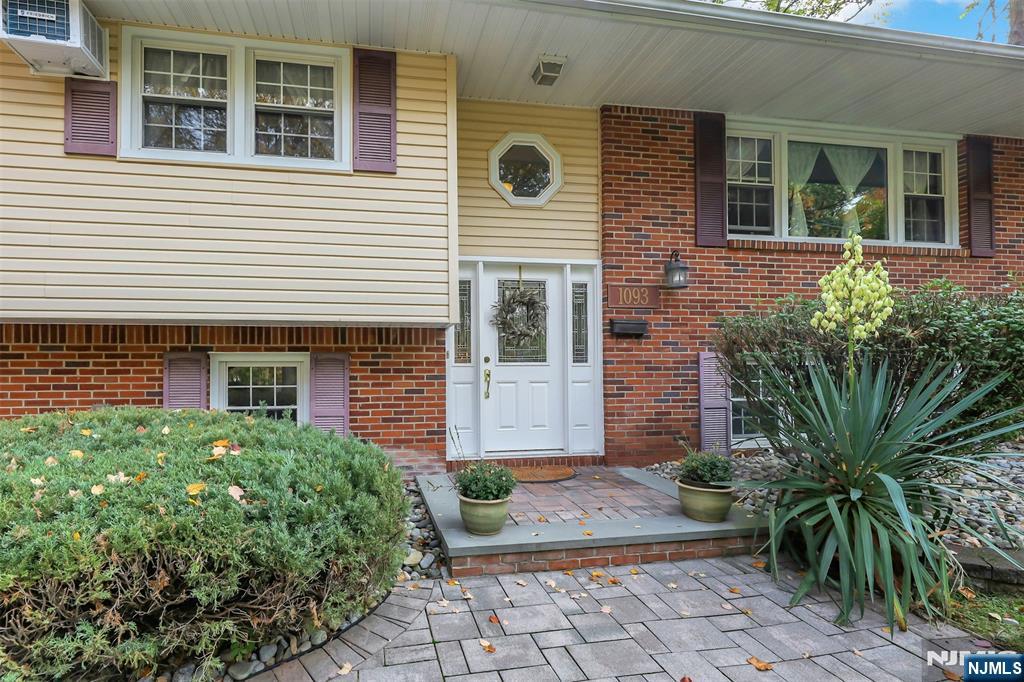 1093 Sheridan Street New Milford, NJ 07646 - Photo 15 of 45 a front view of a house with garden