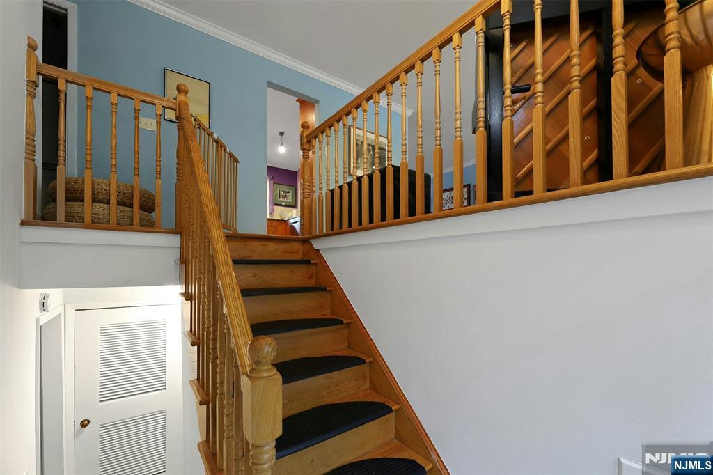 1093 Sheridan Street New Milford, NJ 07646 - Photo 17 of 45 a view of an entryway with staircase