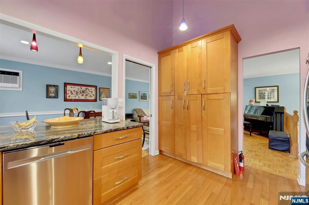 1093 Sheridan Street New Milford, NJ 07646 - Photo 34 of 45 a en suite bathroom with a granite countertop sink and a mirror