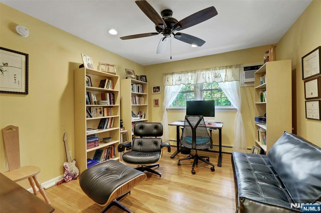 1093 Sheridan Street New Milford, NJ 07646 - Photo 43 of 45 a living room with furniture and a wooden floor