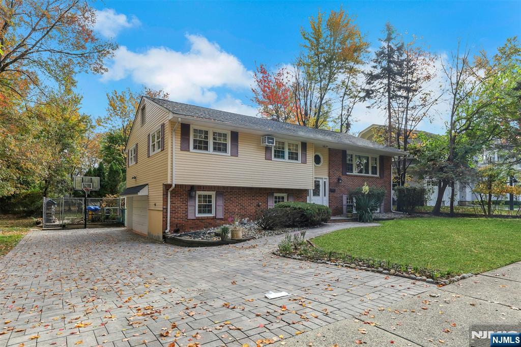1093 Sheridan Street New Milford, NJ 07646 - Photo 5 of 45 a view of a house with a garden