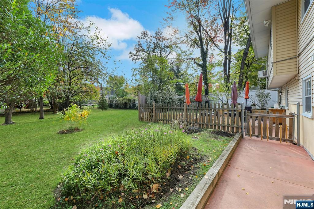 1093 Sheridan Street New Milford, NJ 07646 - Photo 9 of 45 a view of a garden with a trees