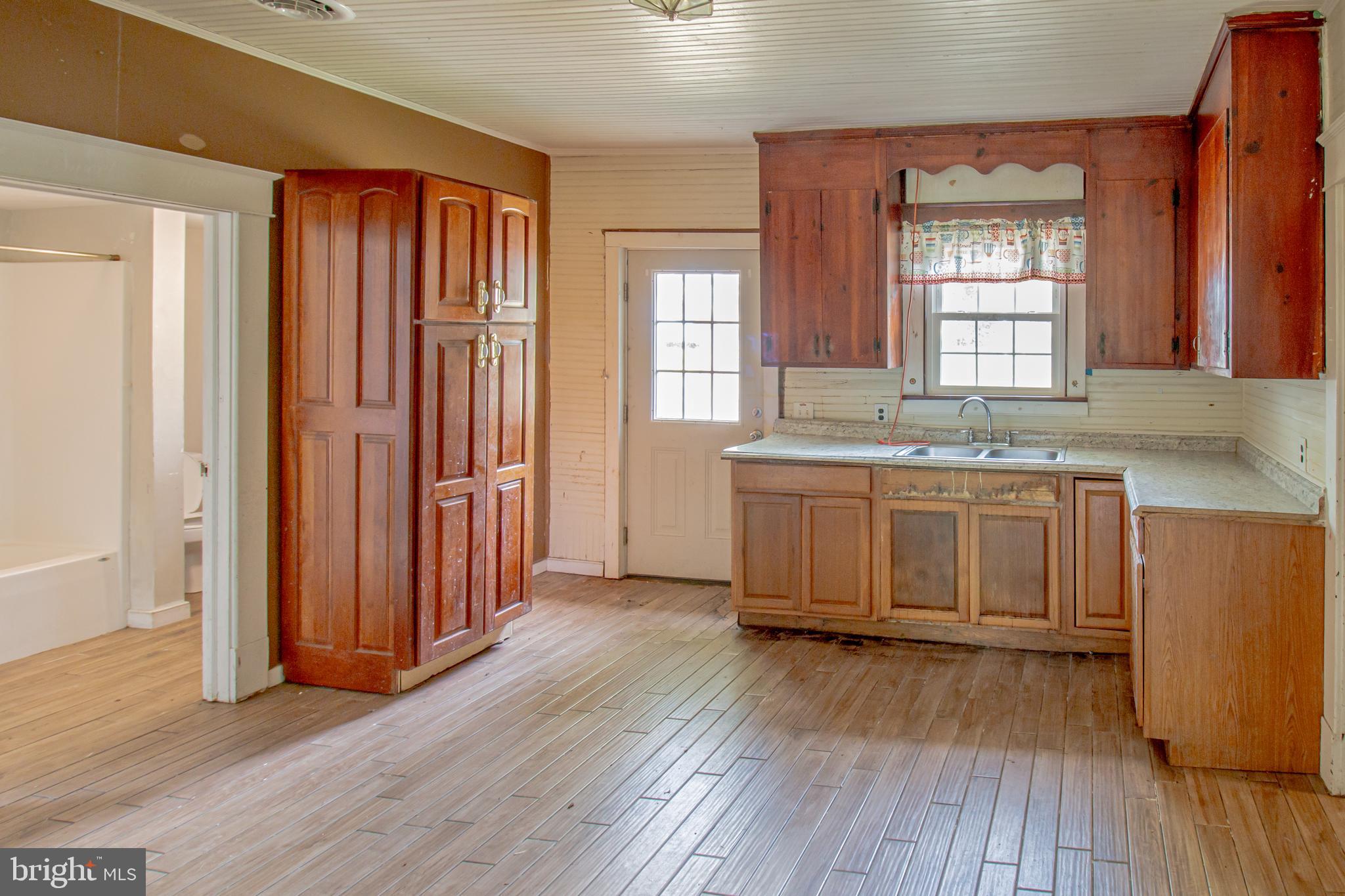 198 Mt Hope Church Road Bumpass, VA 23024 - Photo 12 of 25 a kitchen with stainless steel appliances granite countertop wooden floors and sink