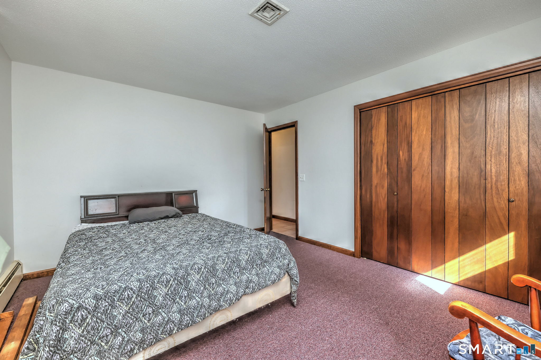 55 East Rutland Road Milford, CT 06461 - Photo 11 of 20 a bedroom with a bed and a dresser