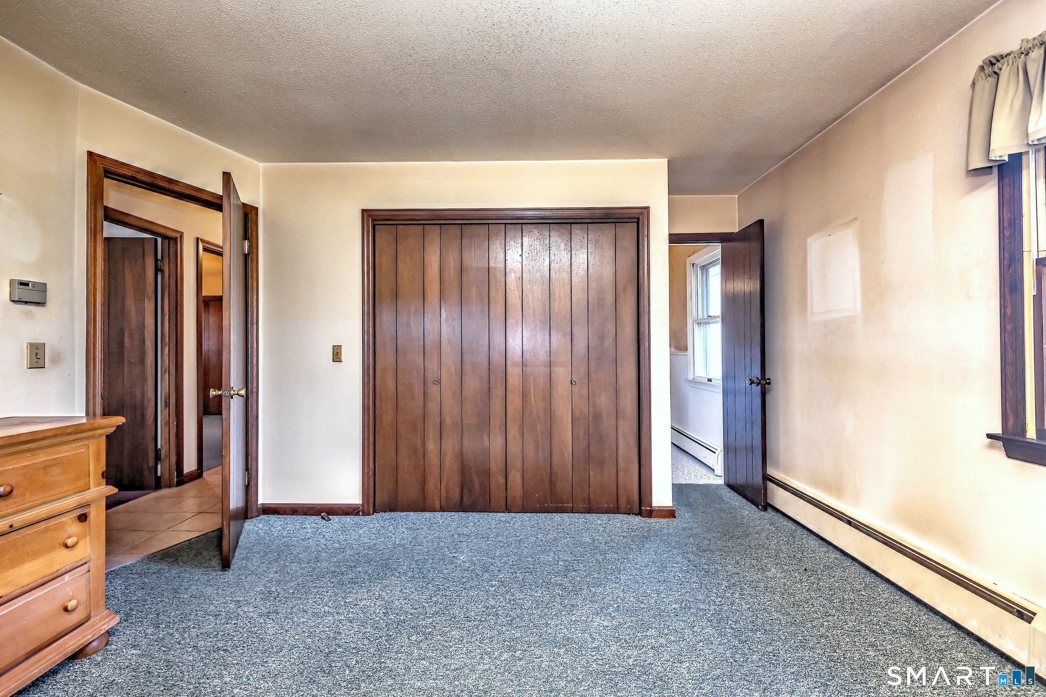 55 East Rutland Road Milford, CT 06461 - Photo 12 of 20 an empty room with windows closet and couch