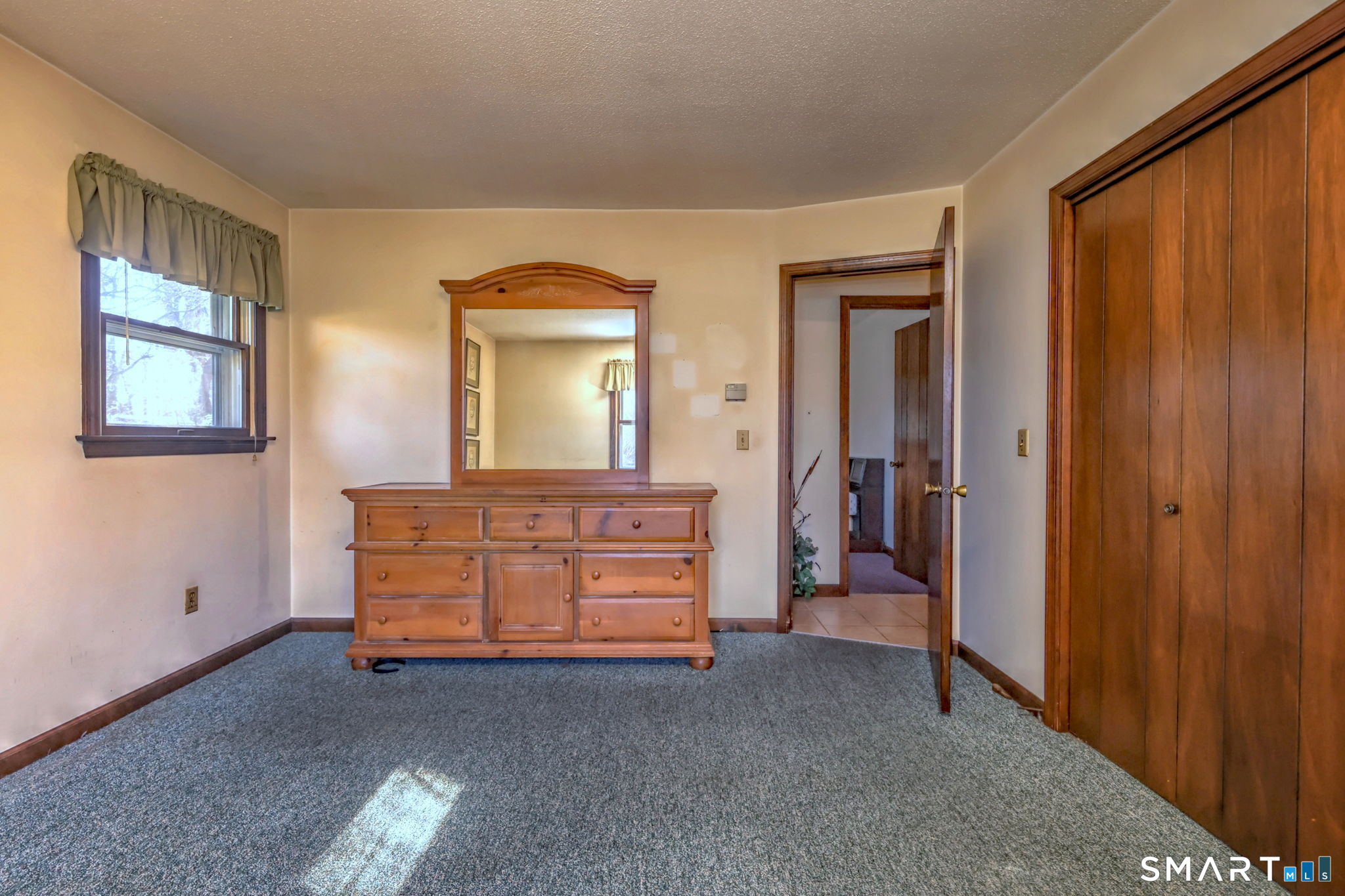 55 East Rutland Road Milford, CT 06461 - Photo 13 of 20 a room with furniture and a dresser