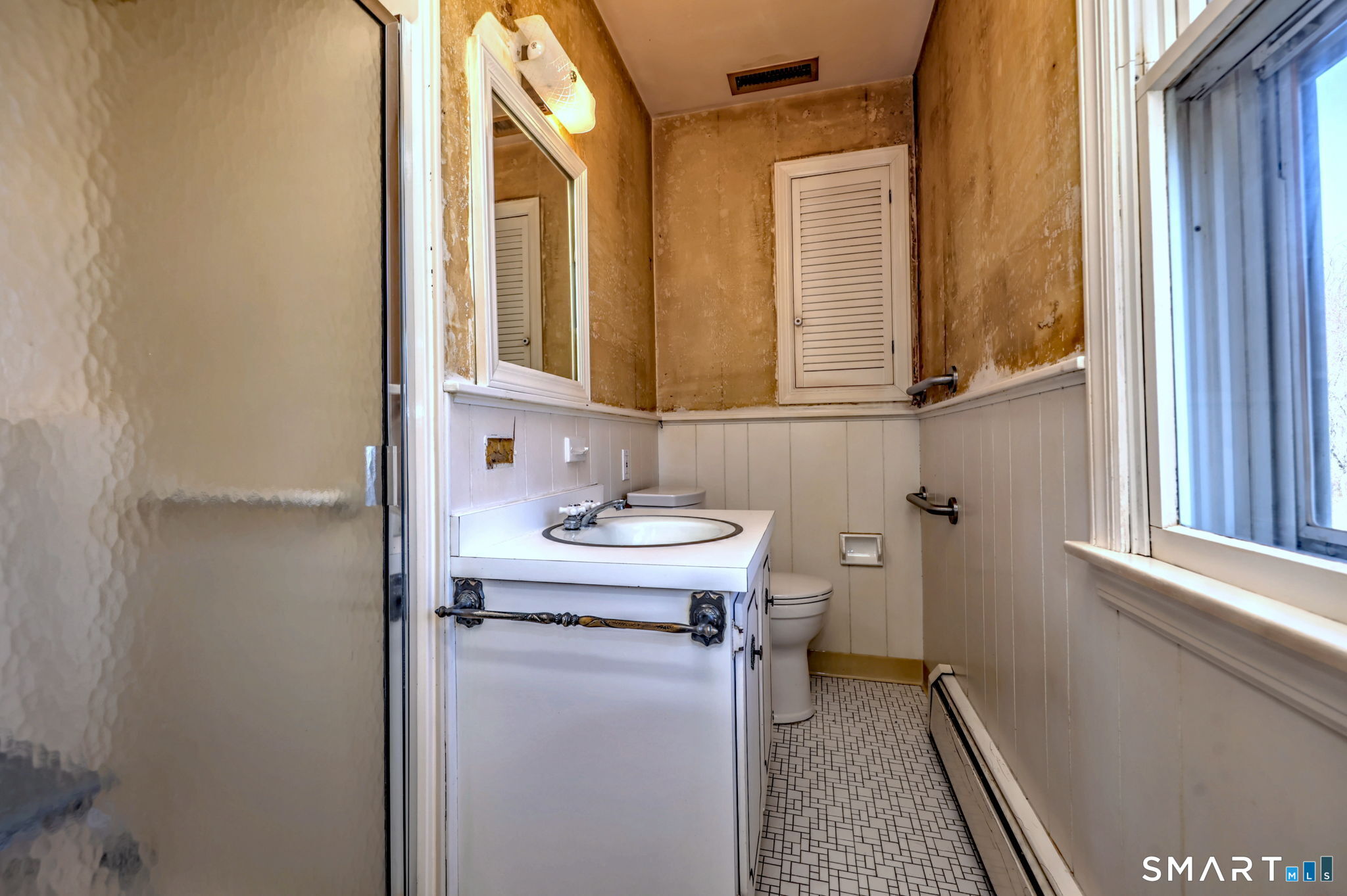 55 East Rutland Road Milford, CT 06461 - Photo 14 of 20 a bathroom with a sink a toilet and a mirror
