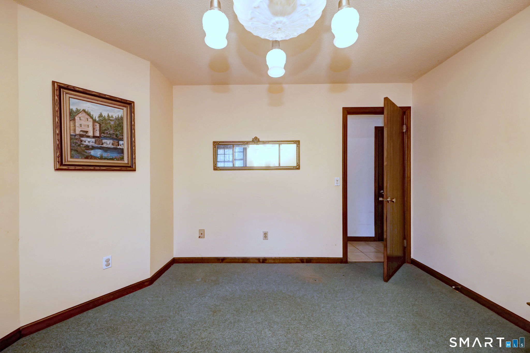 55 East Rutland Road Milford, CT 06461 - Photo 16 of 20 a view of an empty room with a chandelier fan