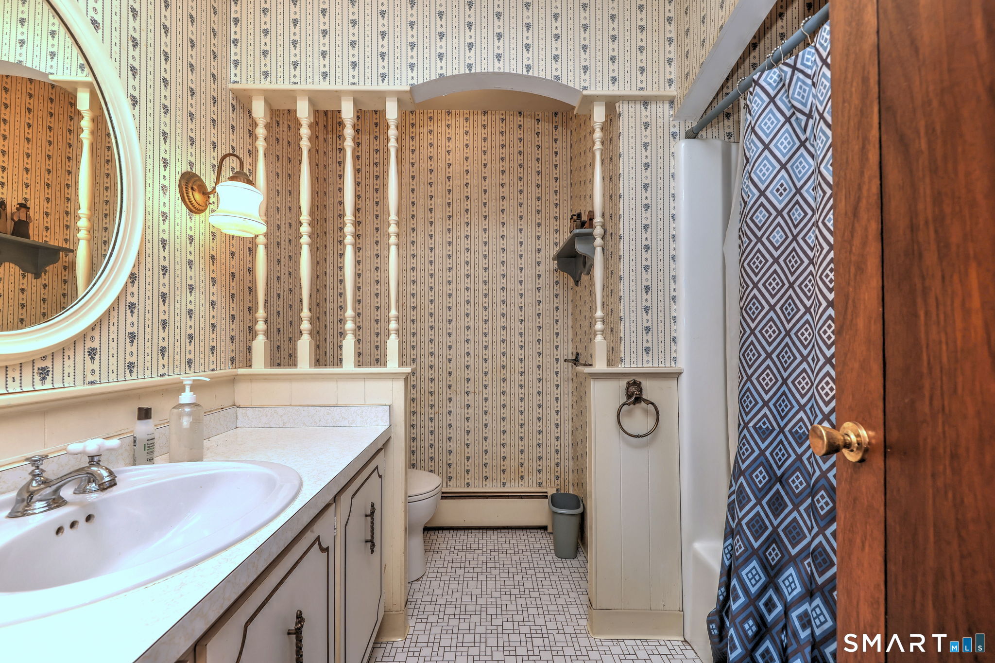 55 East Rutland Road Milford, CT 06461 - Photo 17 of 20 a bathroom with a sink a toilet and shower