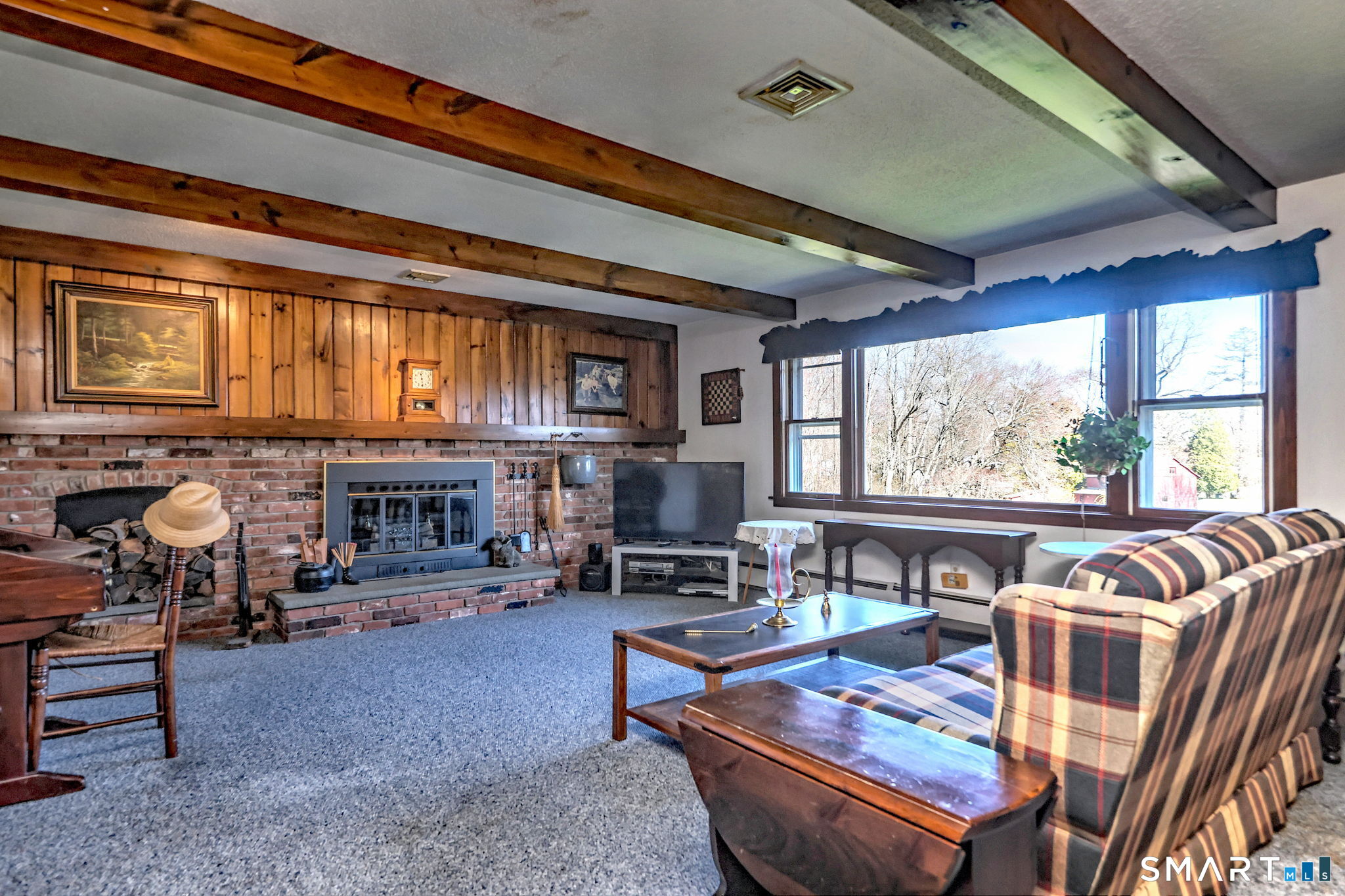 55 East Rutland Road Milford, CT 06461 - Photo 5 of 20 a living room with furniture a fireplace and large windows