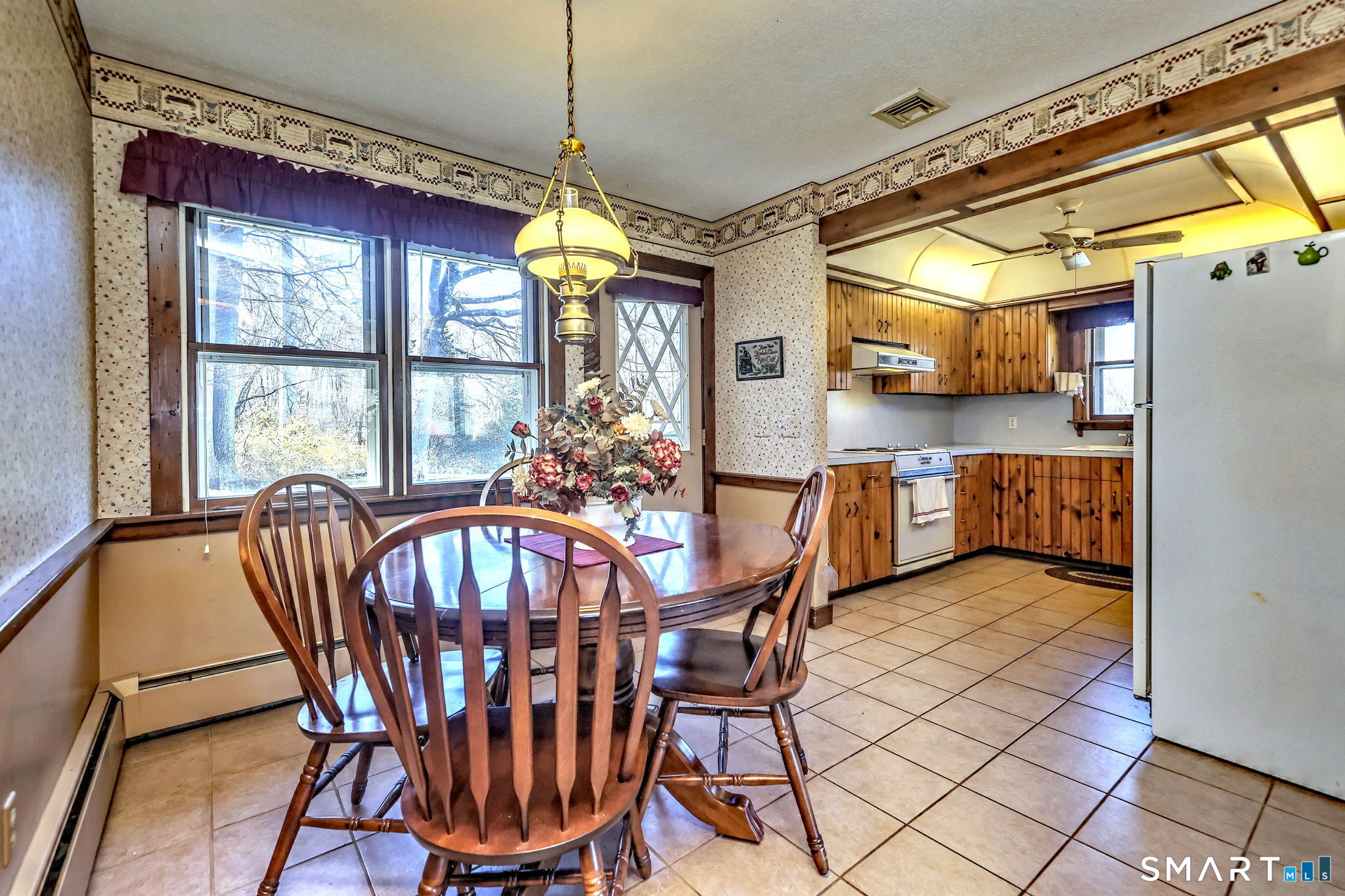 55 East Rutland Road Milford, CT 06461 - Photo 7 of 20 a view of a dining room with furniture window and outside view