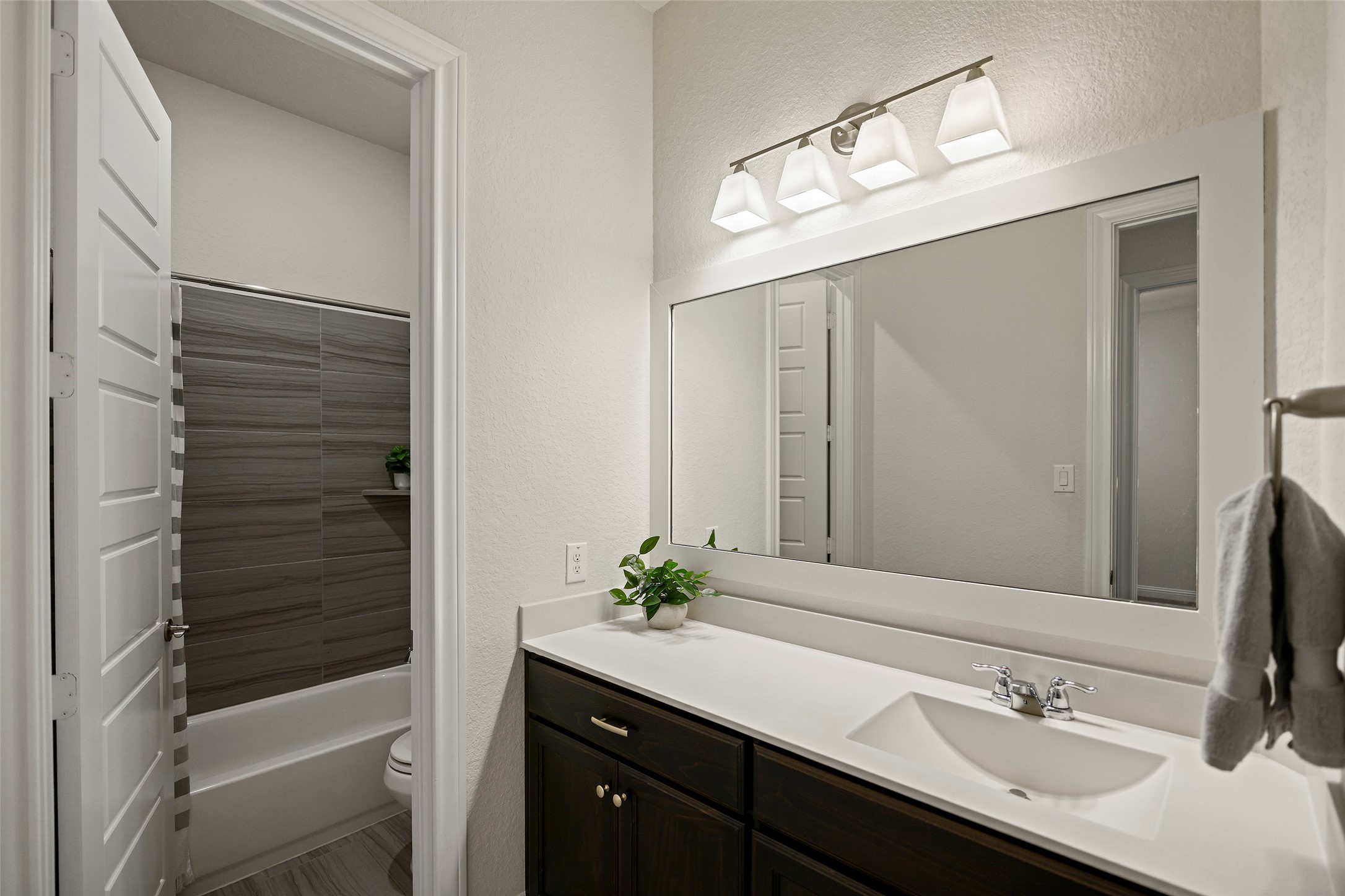 20330 Rosegold Way Spring, TX 77379 - Photo 27 of 48 Full secondary bathroom with oversized vanity and modern finishes.