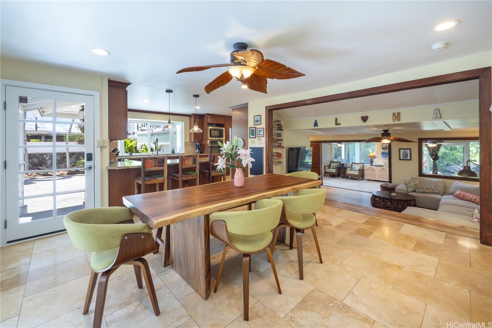 409 Wanaao Road Kailua, HI 96734 - Photo 2 of 25 a dining room with furniture and a large window