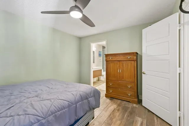 a bedroom with a bed and a dresser